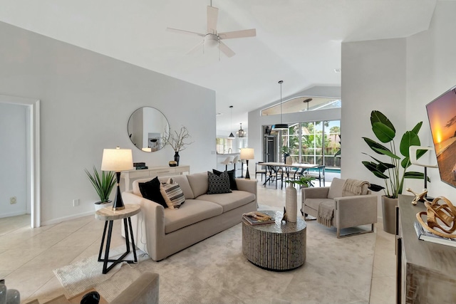 living room featuring ceiling fan, lofted ceiling, and light tile patterned floors