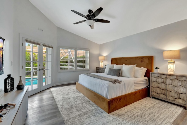 bedroom with lofted ceiling, light wood-type flooring, access to outside, and ceiling fan