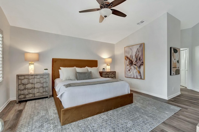 bedroom with wood-type flooring, ceiling fan, and vaulted ceiling