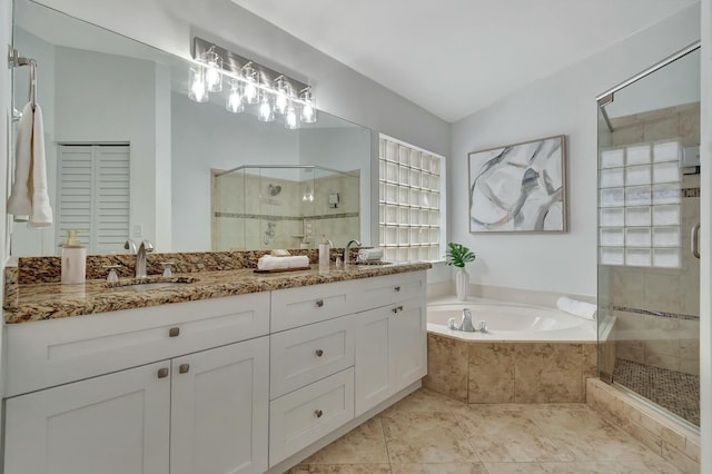 bathroom featuring vanity, separate shower and tub, and tile patterned floors