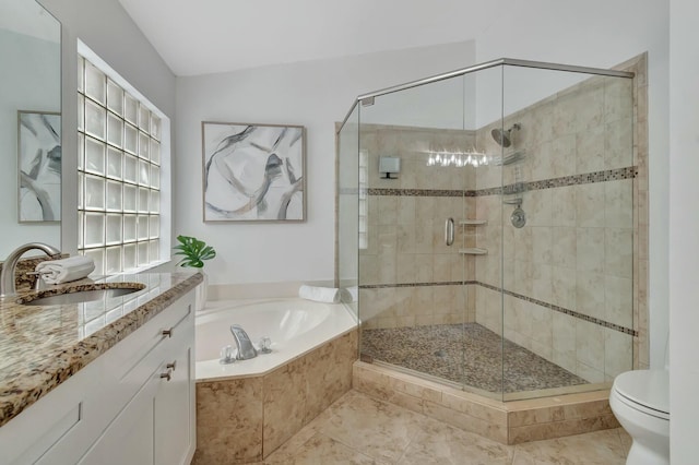 full bathroom featuring vanity, tile patterned floors, toilet, and separate shower and tub