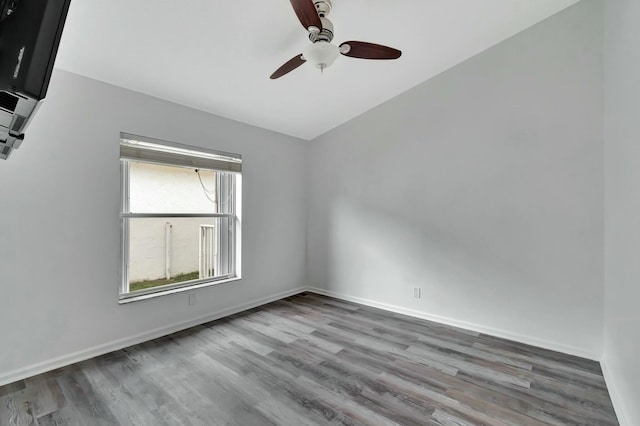 empty room featuring ceiling fan and hardwood / wood-style floors