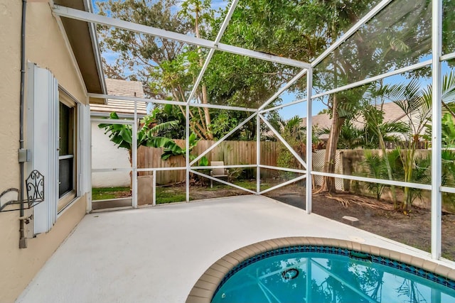 view of pool with a lanai and a patio area