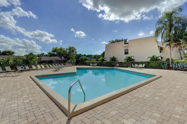 view of swimming pool with a patio area