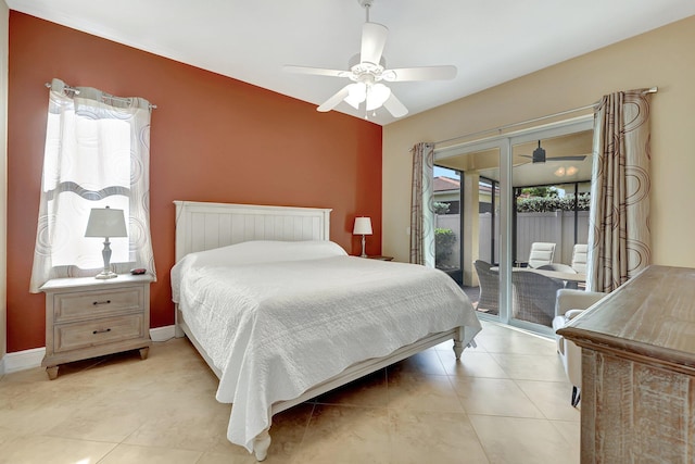 tiled bedroom with ceiling fan and access to outside