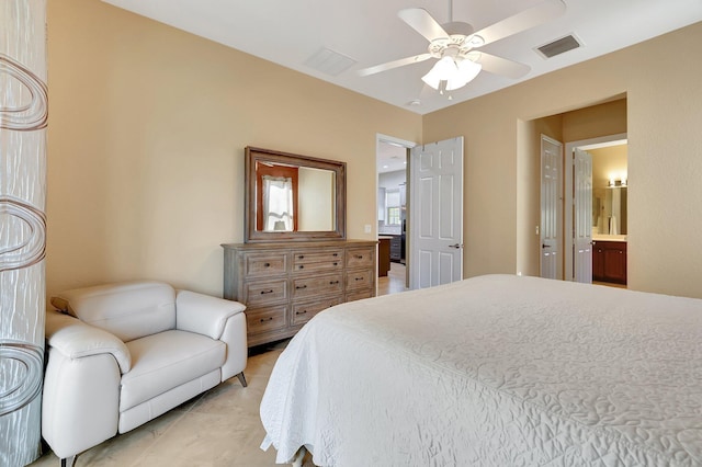 bedroom featuring ceiling fan, light tile patterned floors, and ensuite bathroom