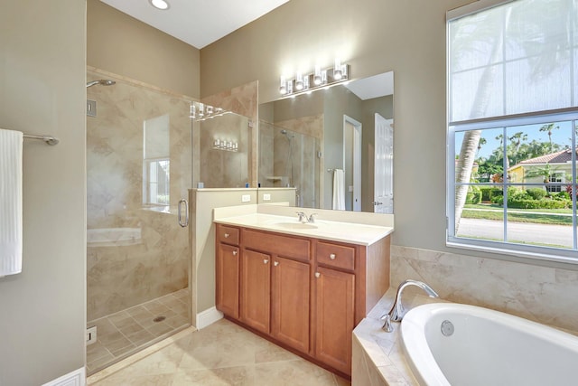 bathroom with vanity, tile patterned floors, and plus walk in shower