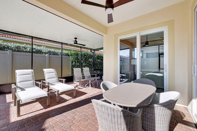 sunroom with ceiling fan