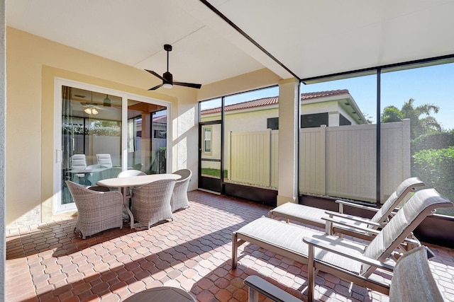 sunroom / solarium with ceiling fan