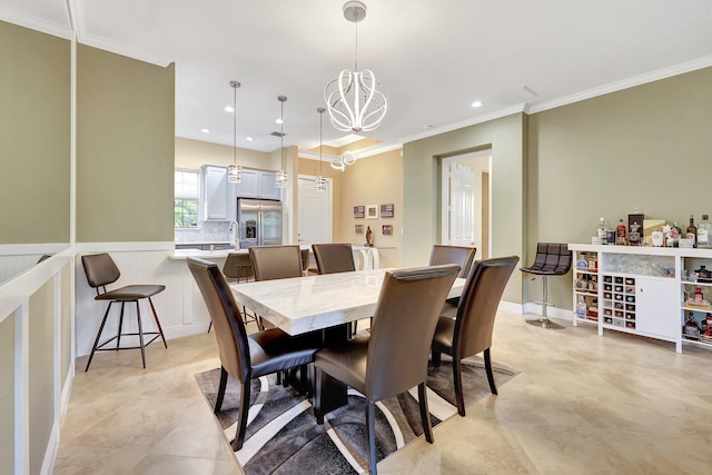 dining room with an inviting chandelier and crown molding