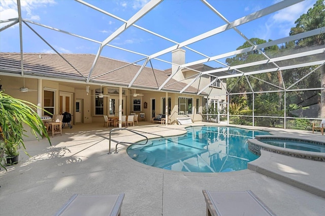 view of pool featuring a lanai, an in ground hot tub, a patio, and french doors