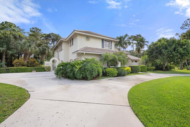 view of home's exterior with a lawn