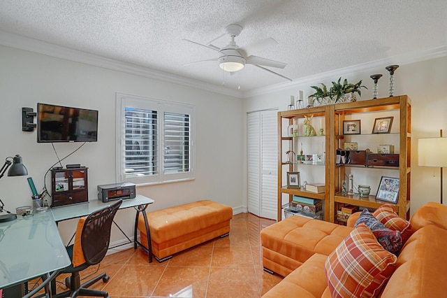 tiled office featuring crown molding, ceiling fan, and a textured ceiling