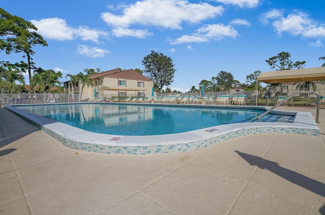 view of swimming pool with a patio