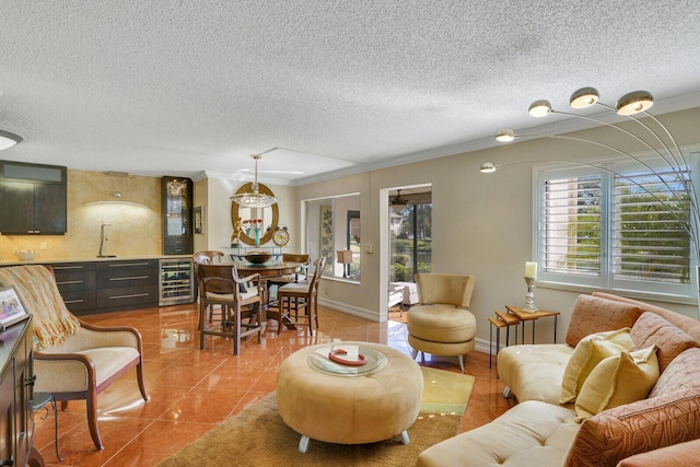 living room featuring tile patterned floors, ornamental molding, and beverage cooler