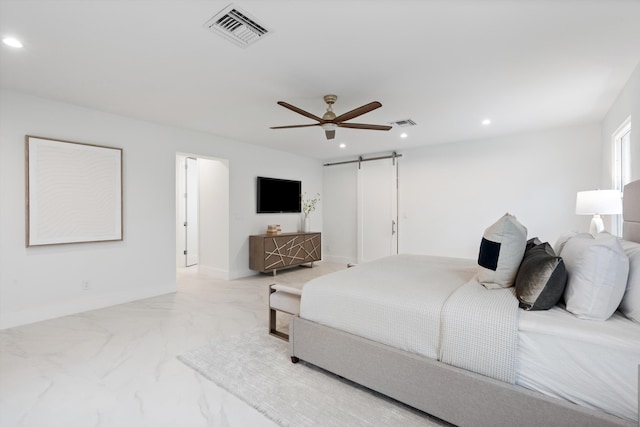 bedroom with a barn door, visible vents, baseboards, marble finish floor, and recessed lighting