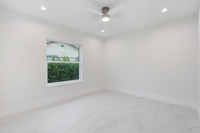 unfurnished room featuring marble finish floor, baseboards, a ceiling fan, and recessed lighting