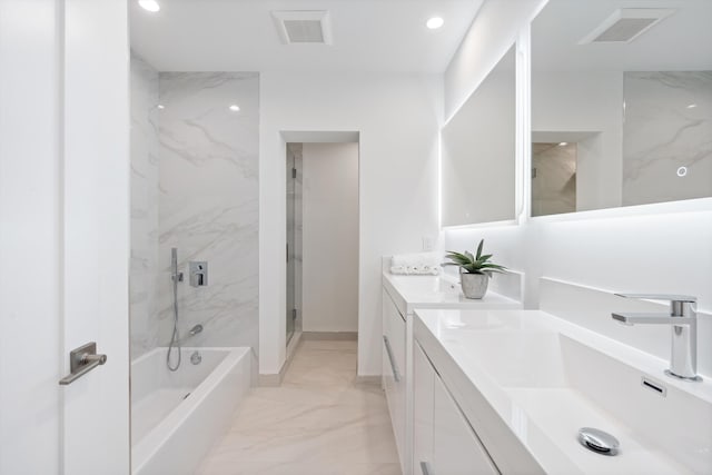 bathroom with double vanity, visible vents, marble finish floor, an enclosed shower, and a sink