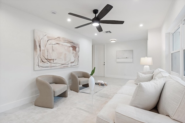 living area with recessed lighting, ceiling fan, and baseboards