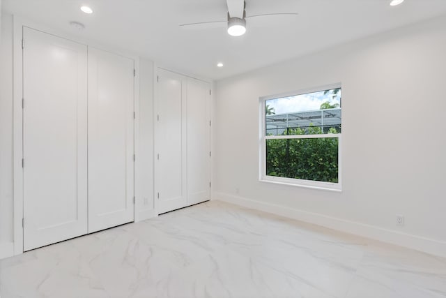unfurnished bedroom featuring multiple closets, recessed lighting, and baseboards