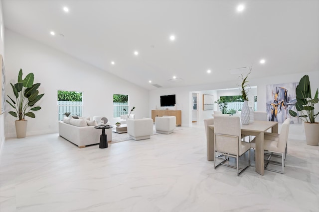 dining area with high vaulted ceiling, recessed lighting, and marble finish floor