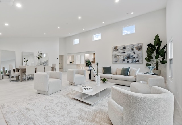 1338 SW 13th St, Boca Raton, FL 33486 - living room featuring a high ceiling, recessed lighting, and healthy amount of natural light