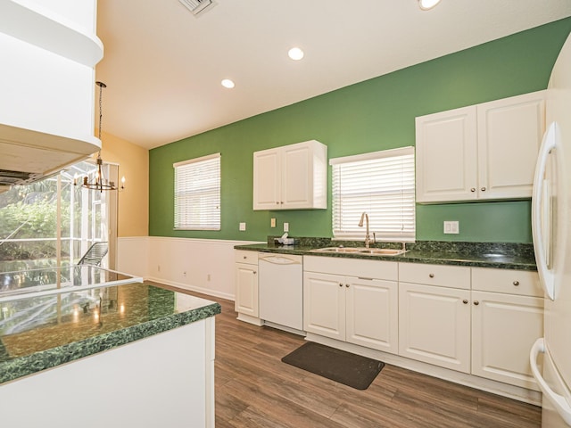 kitchen featuring white appliances, white cabinets, sink, dark hardwood / wood-style floors, and decorative light fixtures