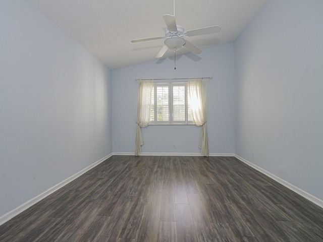 spare room with dark hardwood / wood-style flooring, ceiling fan, and lofted ceiling