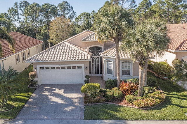 mediterranean / spanish-style home featuring a garage