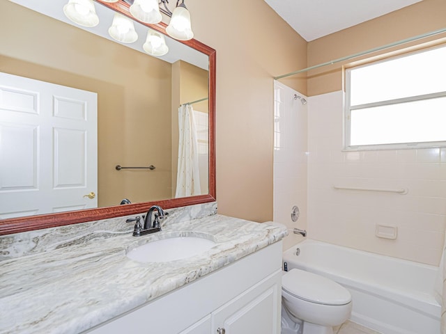 full bathroom featuring shower / bath combo with shower curtain, vanity, and toilet