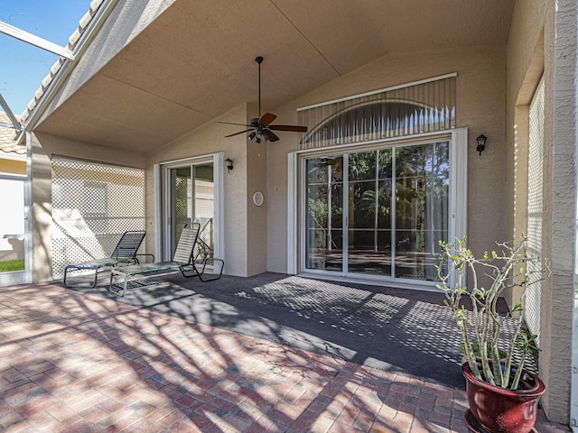 view of patio featuring ceiling fan