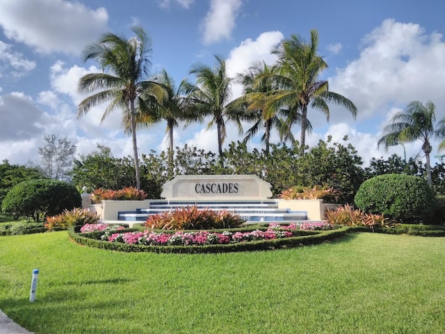 community / neighborhood sign with a lawn