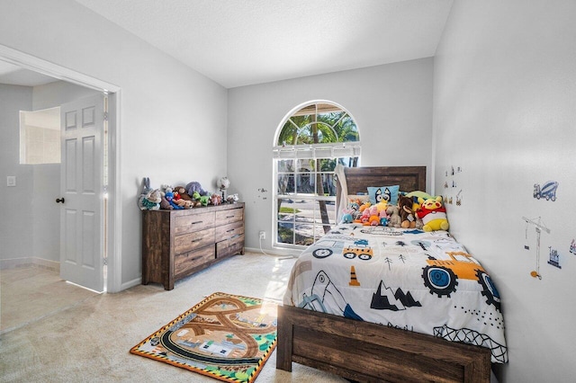 bedroom with light carpet