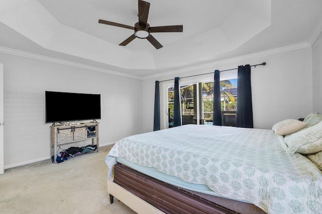 carpeted bedroom featuring a raised ceiling, access to exterior, ceiling fan, and crown molding