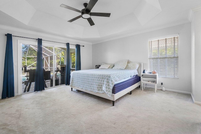 bedroom featuring a tray ceiling, access to exterior, ceiling fan, and carpet flooring