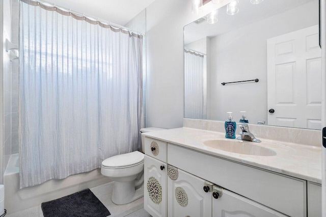 full bathroom featuring tile patterned flooring, vanity, toilet, and shower / tub combo