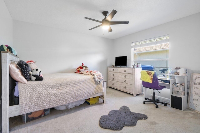 bedroom featuring ceiling fan and light colored carpet