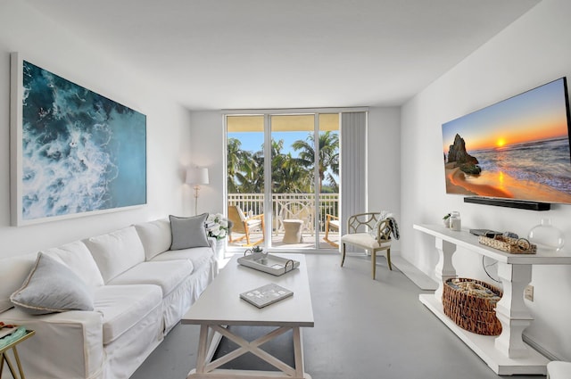 living room with expansive windows and concrete flooring