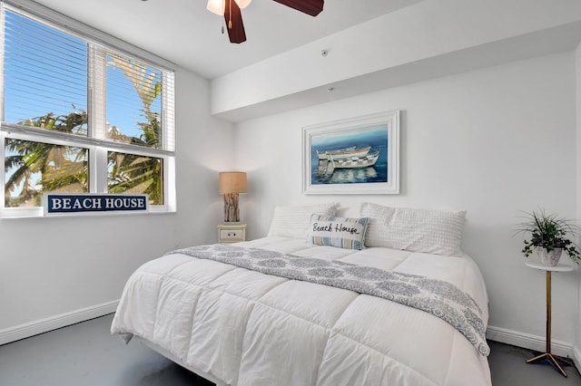 bedroom with ceiling fan and multiple windows