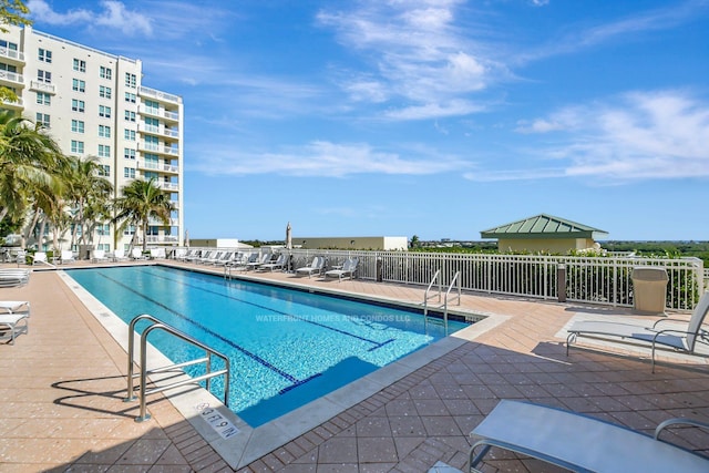 view of swimming pool with a patio