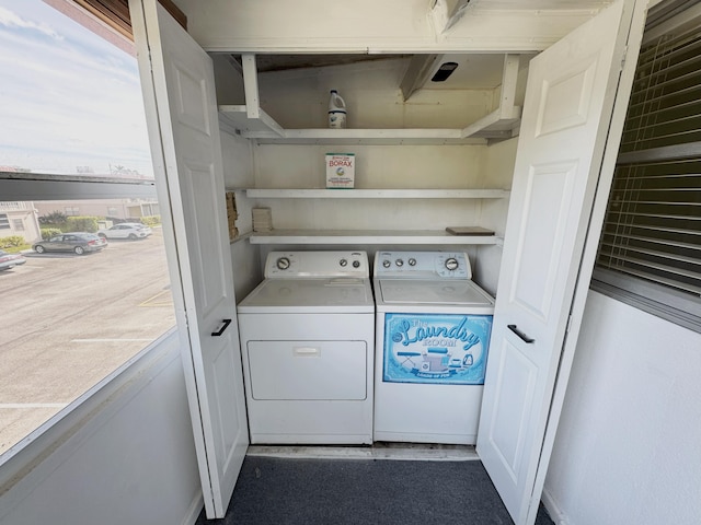 laundry room featuring washing machine and clothes dryer