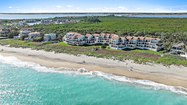 bird's eye view featuring a beach view and a water view