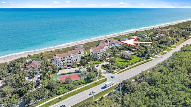 bird's eye view featuring a beach view and a water view