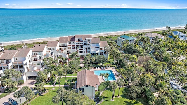 bird's eye view featuring a water view and a view of the beach