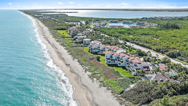 aerial view featuring a water view and a view of the beach