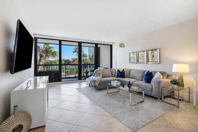 tiled living room featuring a wall of windows