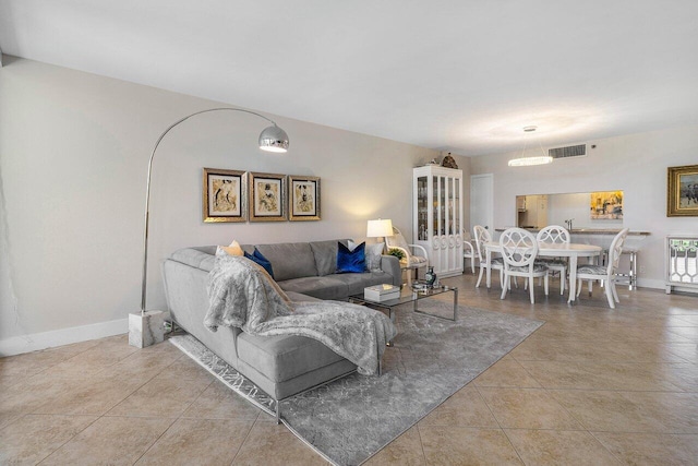 living room with tile patterned flooring