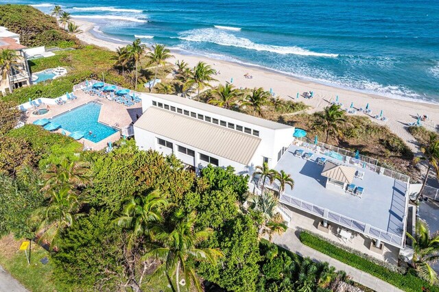 bird's eye view featuring a water view and a view of the beach