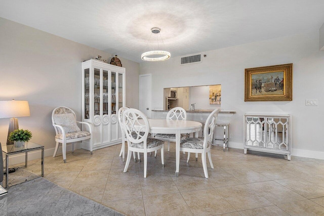 dining space with light tile patterned floors