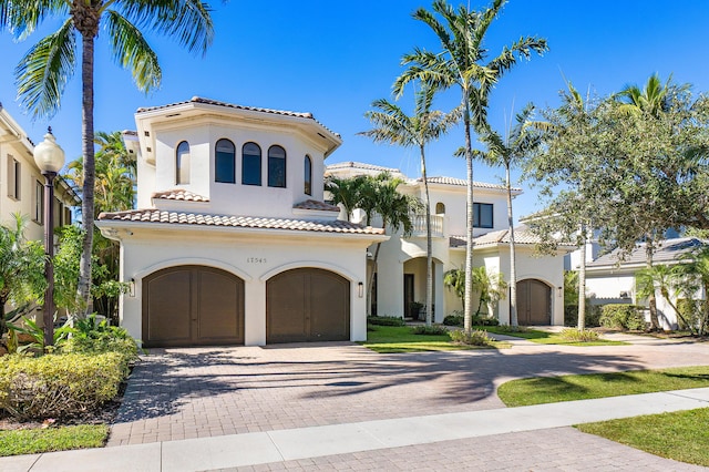 mediterranean / spanish house with a garage